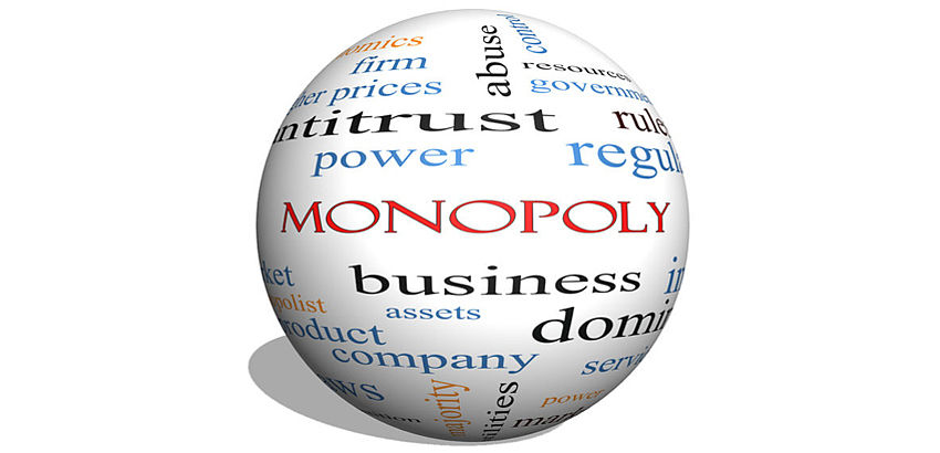 Krogljica z napisom monopoly, business, antitrust itd.